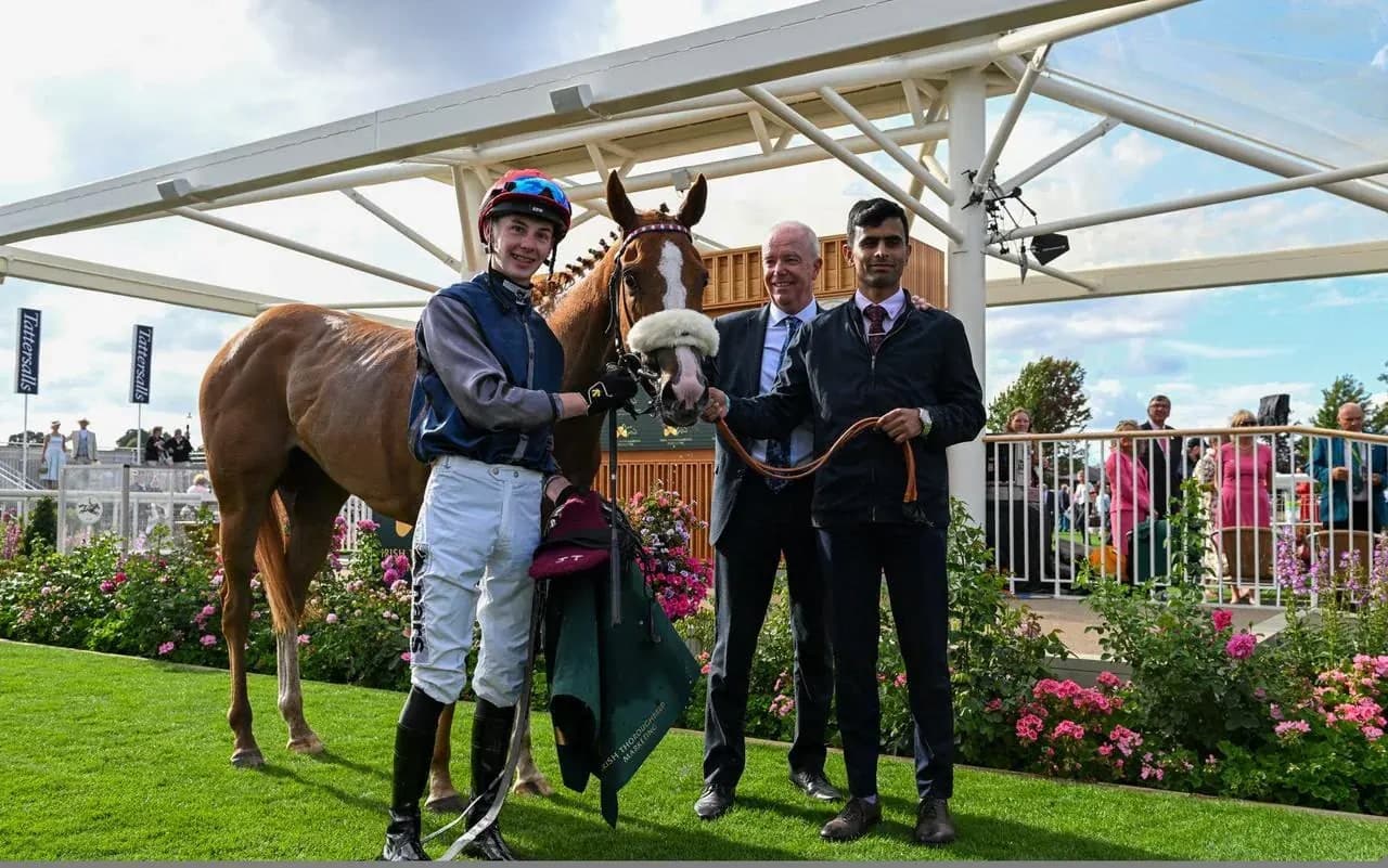 Miss Yechance with jockey Jack Nicholls and two men in the winner's enclosure at York